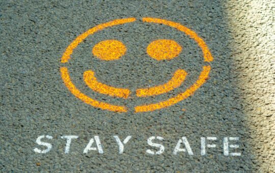 Stay safe written on the floor as Anthropic has detailed its safety strategy to try and keep its popular AI model, Claude, helpful while avoiding perpetuating harms.